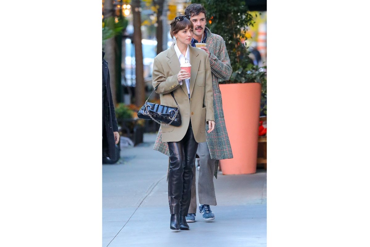 Dakota Johnson Wearing Gucci And Carrying A Gucci Horsebit Chain Shoulder Bag