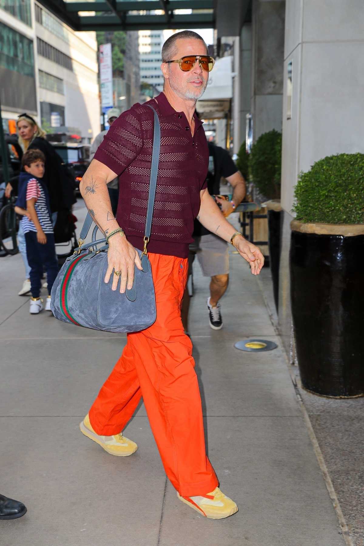 Brad Pitt Carrying A Gucci Duffle Bag