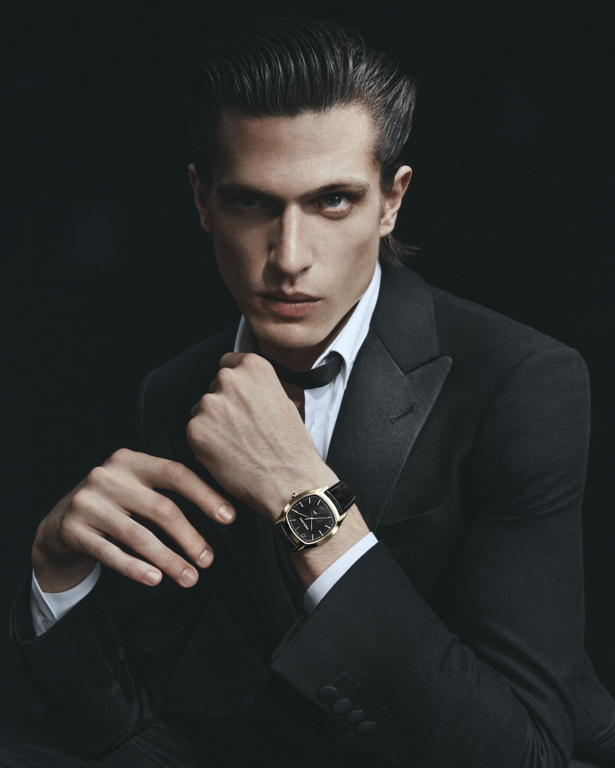 Man with Omega watch and Gucci belt before Giorgio Armani fashion