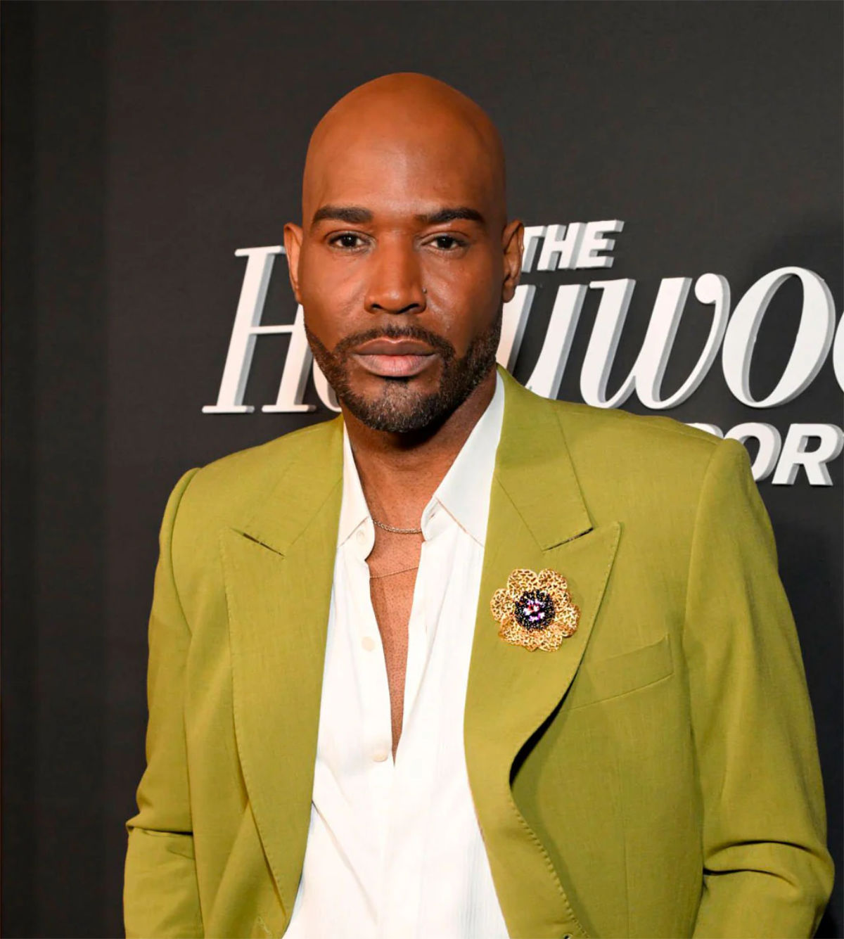 Karamo Brown wearing Alex Soldier Anemone Coronaria Brooch on Jacket Lapel at the Hollywood Reporter