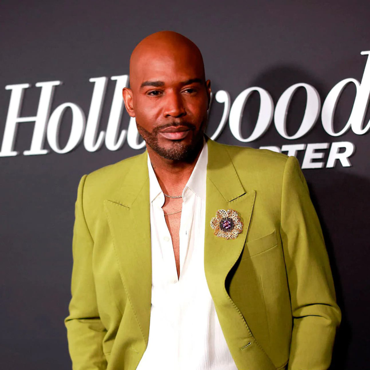 Karamo Brown wearing Alex Soldier Anemone Coronaria Brooch on Jacket Lapel at the Hollywood Reporter