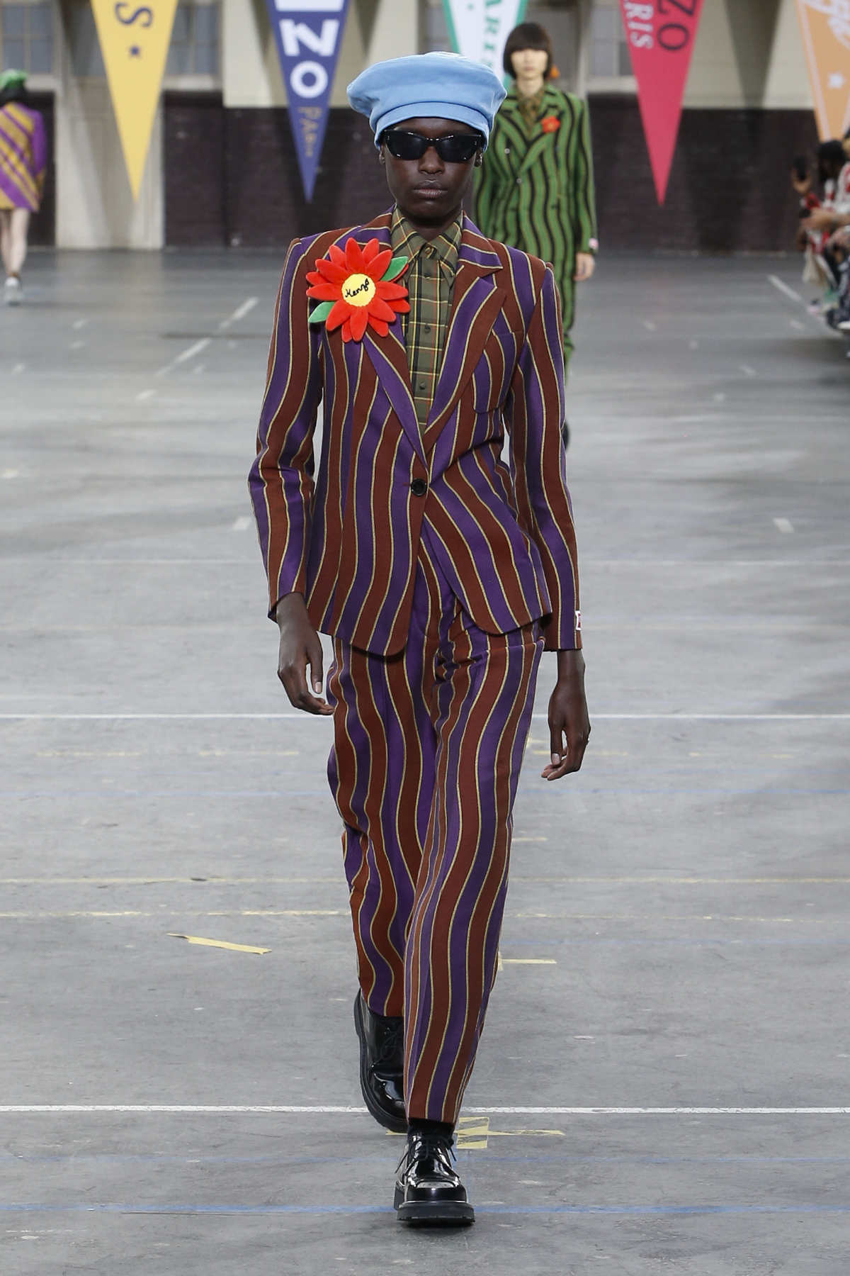 How Kenzo found a preppy, 70s groove at Paris Fashion Week: Nigo's  autumn/winter 2022 menswear collection mixed Scout's scarves with African  vibrancy and Asian crossover styles