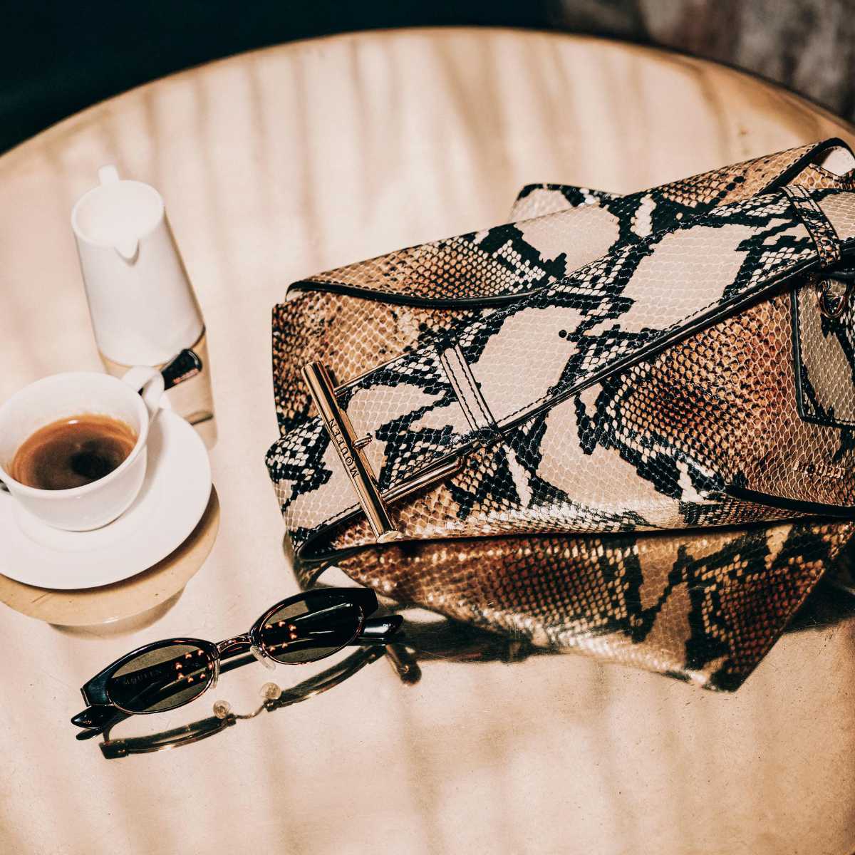 McQueen Introduces Its T-Bar Sling Bag